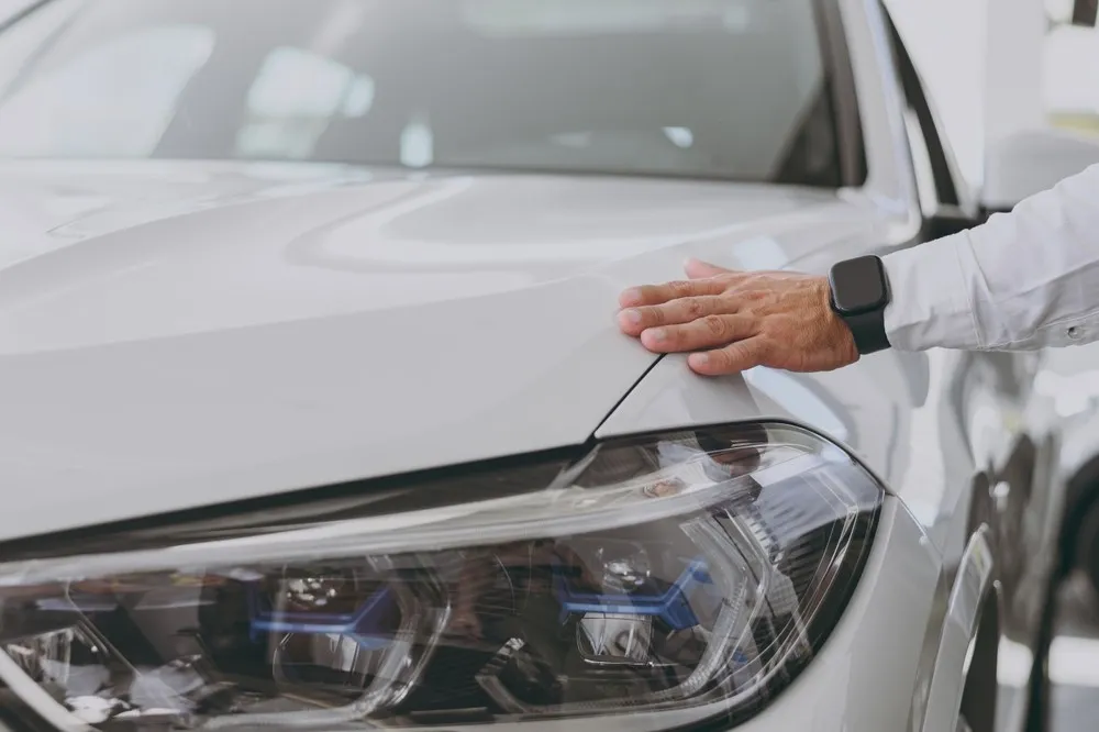Car buying concierge inspection: Audi with the bonnet open on a driveway