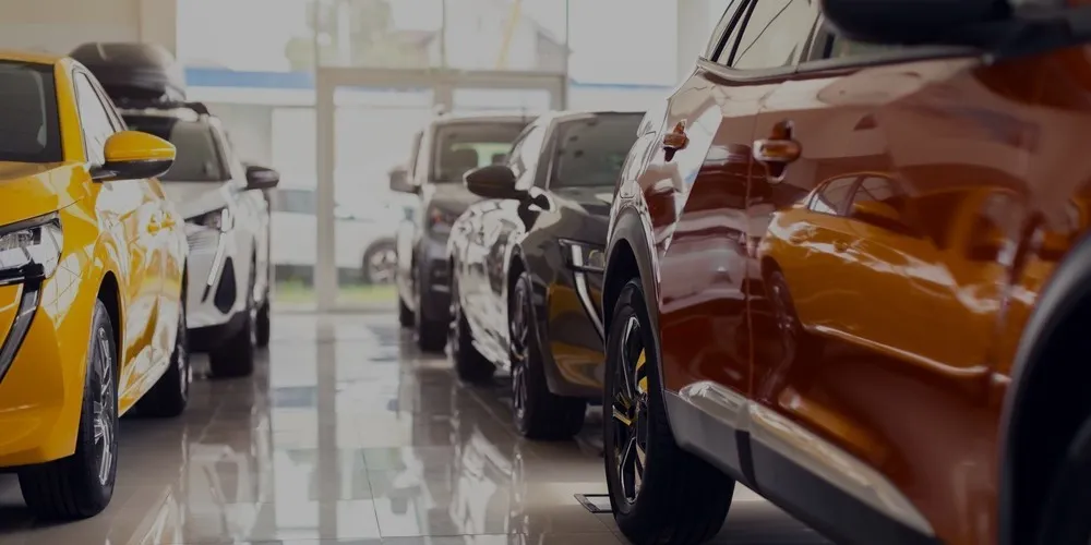 Row of vehicles ready for sale on a forecourt